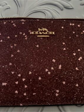Coach Heart Glitter Small Wristlet in raspberry with brass hardware